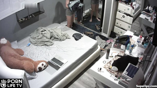 Asian teen changes clothes in her room