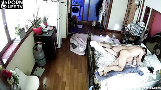 Mature Japanese couple fucks in their bed