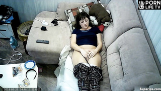 Mature Slavic woman masturbates on the sofa