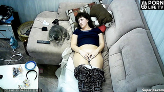 Mature Slavic woman masturbates on the sofa