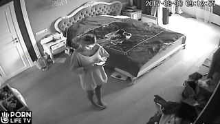 French woman changing clothes in her room