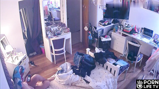 French redhead girl gets dressed in her room