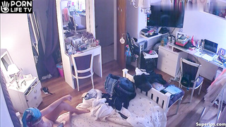 French redhead girl gets dressed in her room