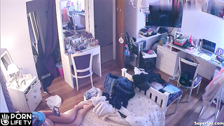 French redhead girl gets dressed in her room