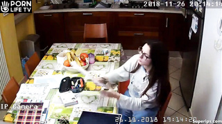 Young American girl masturbates in the kitchen