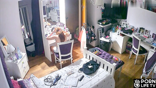 Redhead teenager changes her clothes in her room