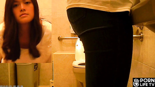 Young Asian girl visits a public restroom