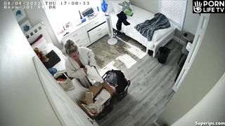 British college girl gets dressed in her room