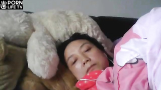 Japanese mom masturbating while watching porn