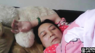 Japanese mom masturbating while watching porn