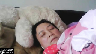 Japanese mom masturbating while watching porn