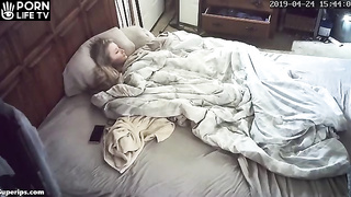 American blonde girl masturbates on her parents bed