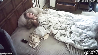 American blonde girl masturbates on her parents bed