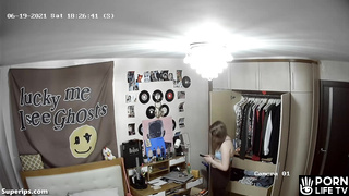 German blonde teen girl gets dressed in her room