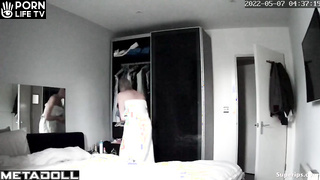 British blonde girl gets dressed in her room