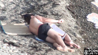 Voyeur caught a hot beach fuck