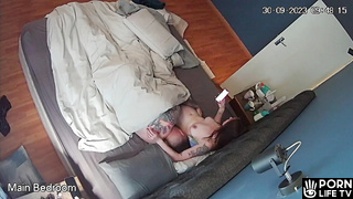 American tattooed couple fucks in their bed