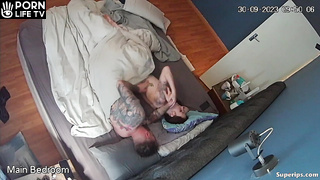 American tattooed couple fucks in their bed